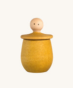 Grapat yellow Little Things. A wooden top with eyes drawn on and a yellow coloured pot to match. Grapat have a wide range of wooden toys and loose parts available at Babipur. 