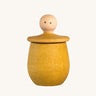 Grapat yellow Little Things. A wooden top with eyes drawn on and a yellow coloured pot to match. Grapat have a wide range of wooden toys and loose parts available at Babipur. 