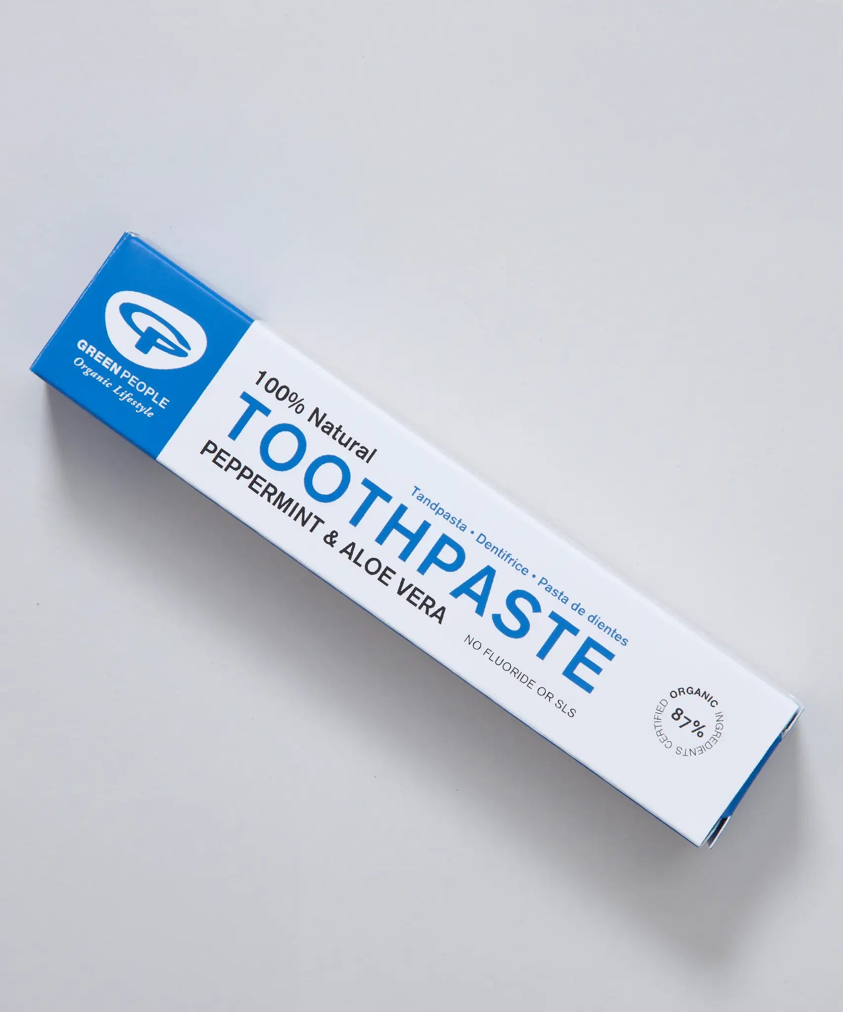 White and blue branded Green People box for the peppermint and aloe vera toothpaste