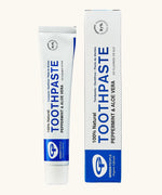 Organic People peppermint and aloe vera toothpaste showing the white tube next to a matching box
