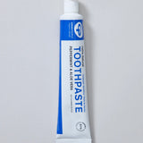 White and blue branded tube of Green People peppermint and aloe vera toothpaste