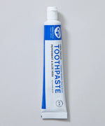 White and blue branded tube of Green People peppermint and aloe vera toothpaste