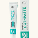 Organic People minty cool toothpaste showing the white and green branded tube next to a matching box