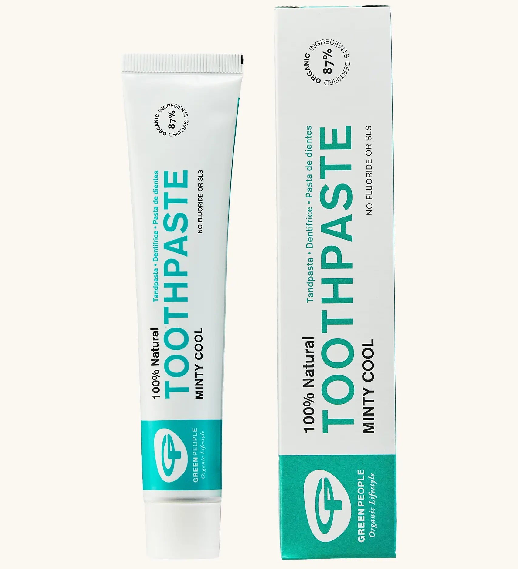 Organic People minty cool toothpaste showing the white and green branded tube next to a matching box