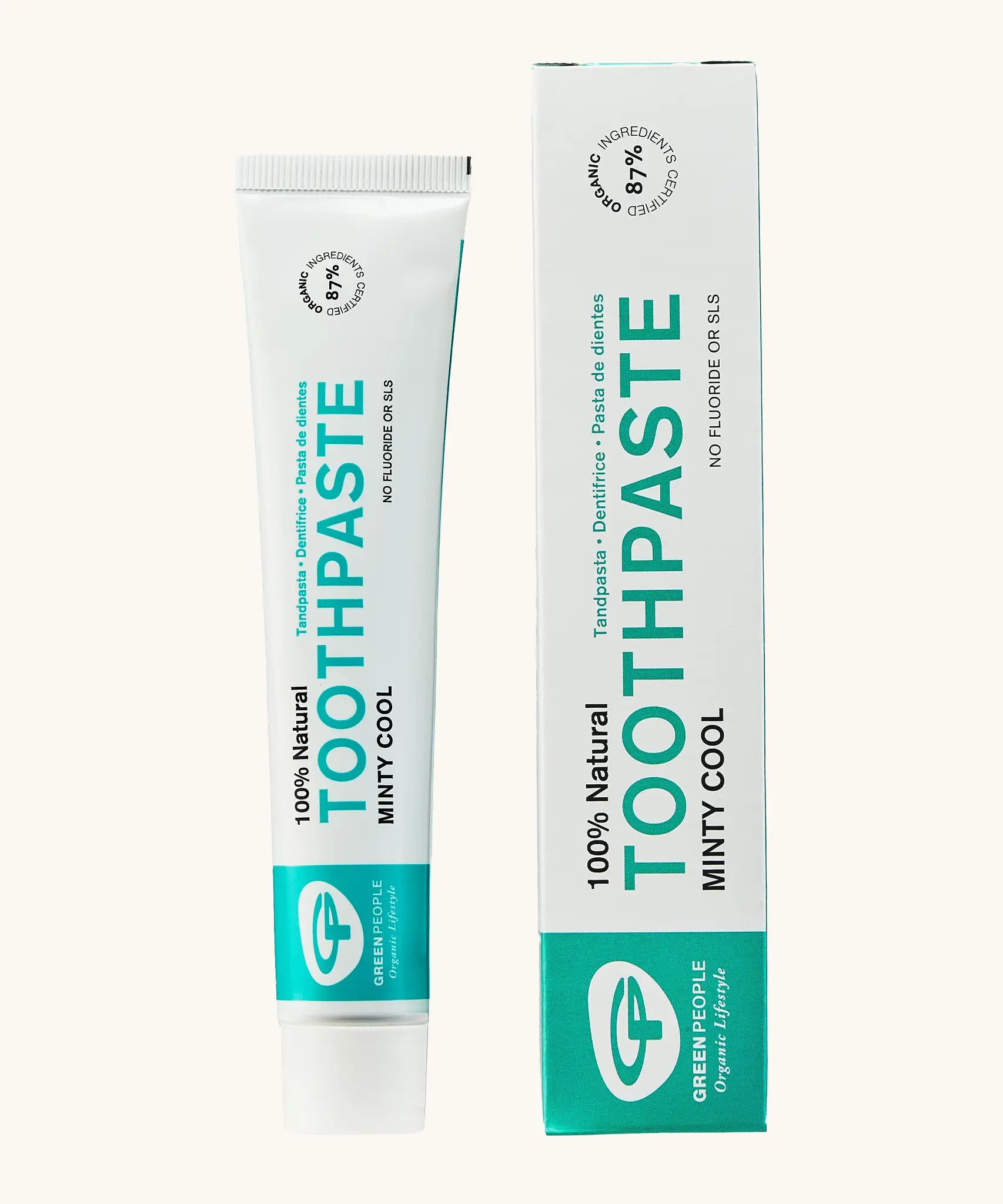 Organic People minty cool toothpaste showing the white and green branded tube next to a matching box