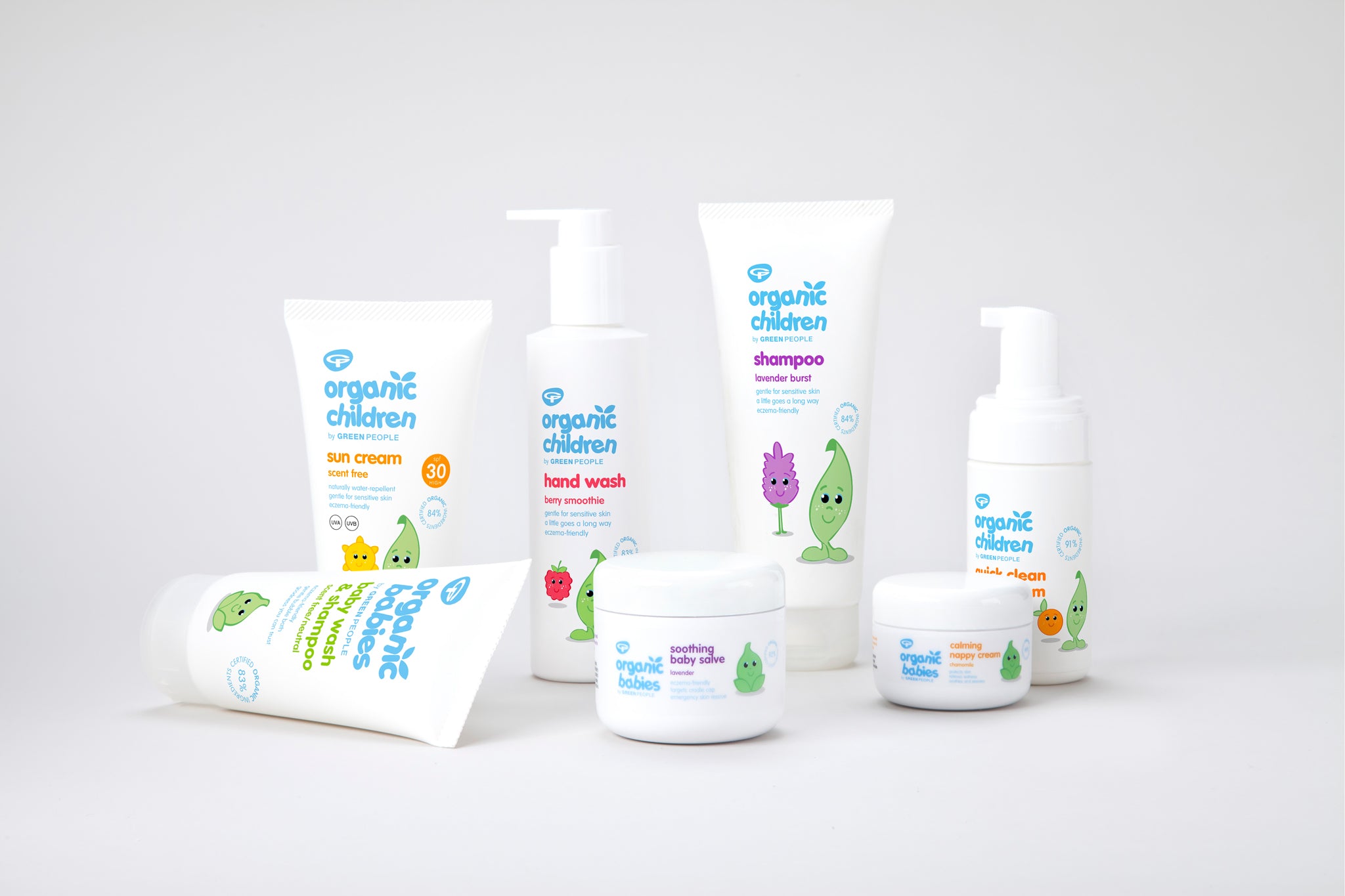 Green People's Organic Children range of baby friendly, natural washes, skincare and sun cream. The products are shown on a plain surface. 