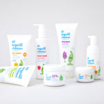 Green People's Organic Children range of baby friendly, natural washes, skincare and sun cream. The products are shown on a plain surface. 