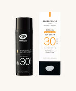 The Green People Sports+ Sun Cream in black sun resistant packaging, next to its cardboard box.