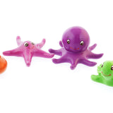 Green rubber toys biodegradable sea creature toys on a white background