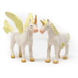 Green Rubber Toys natural rubber golden unicorn and pegasus toys stood on a white background