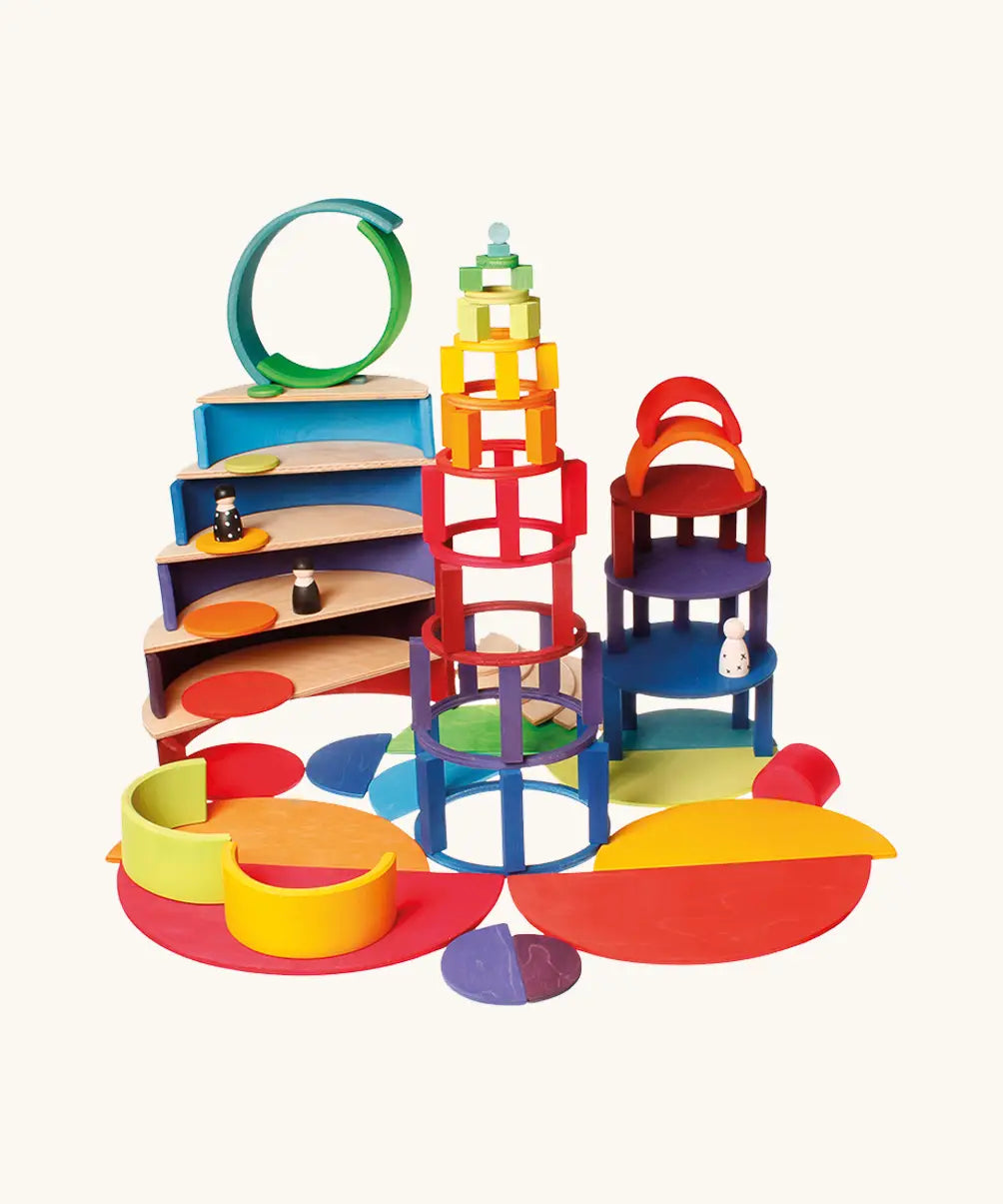 Grimm’s World of Numbers wooden counting toys built into colourful structures, using concentric rings, curved platforms, and number-based pieces for open-ended maths and construction play.