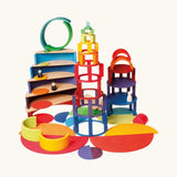 Grimm’s World of Numbers wooden counting toys built into colourful structures, using concentric rings, curved platforms, and number-based pieces for open-ended maths and construction play.
