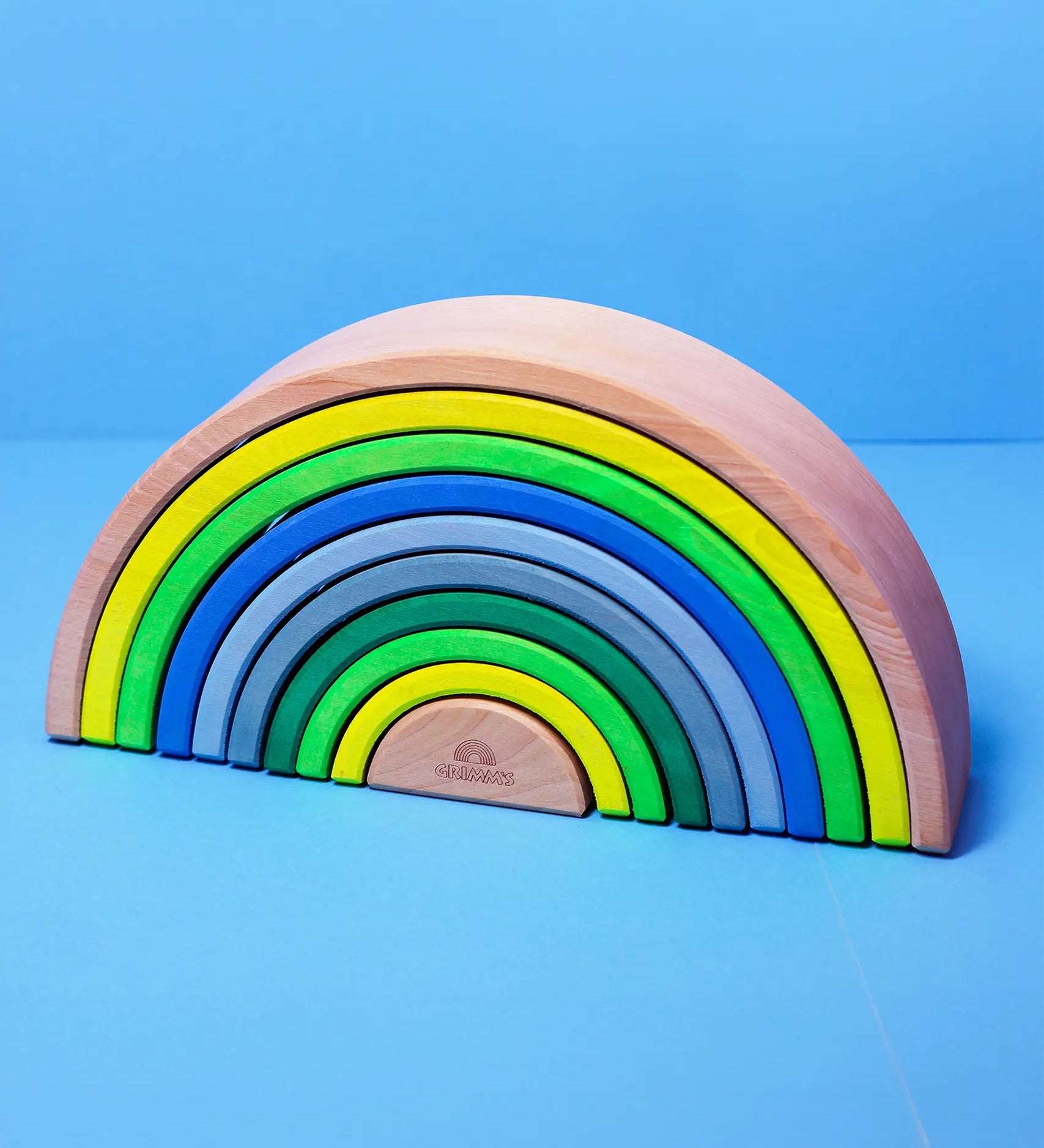 Grimm's 10 piece wooden rainbow in neon green.