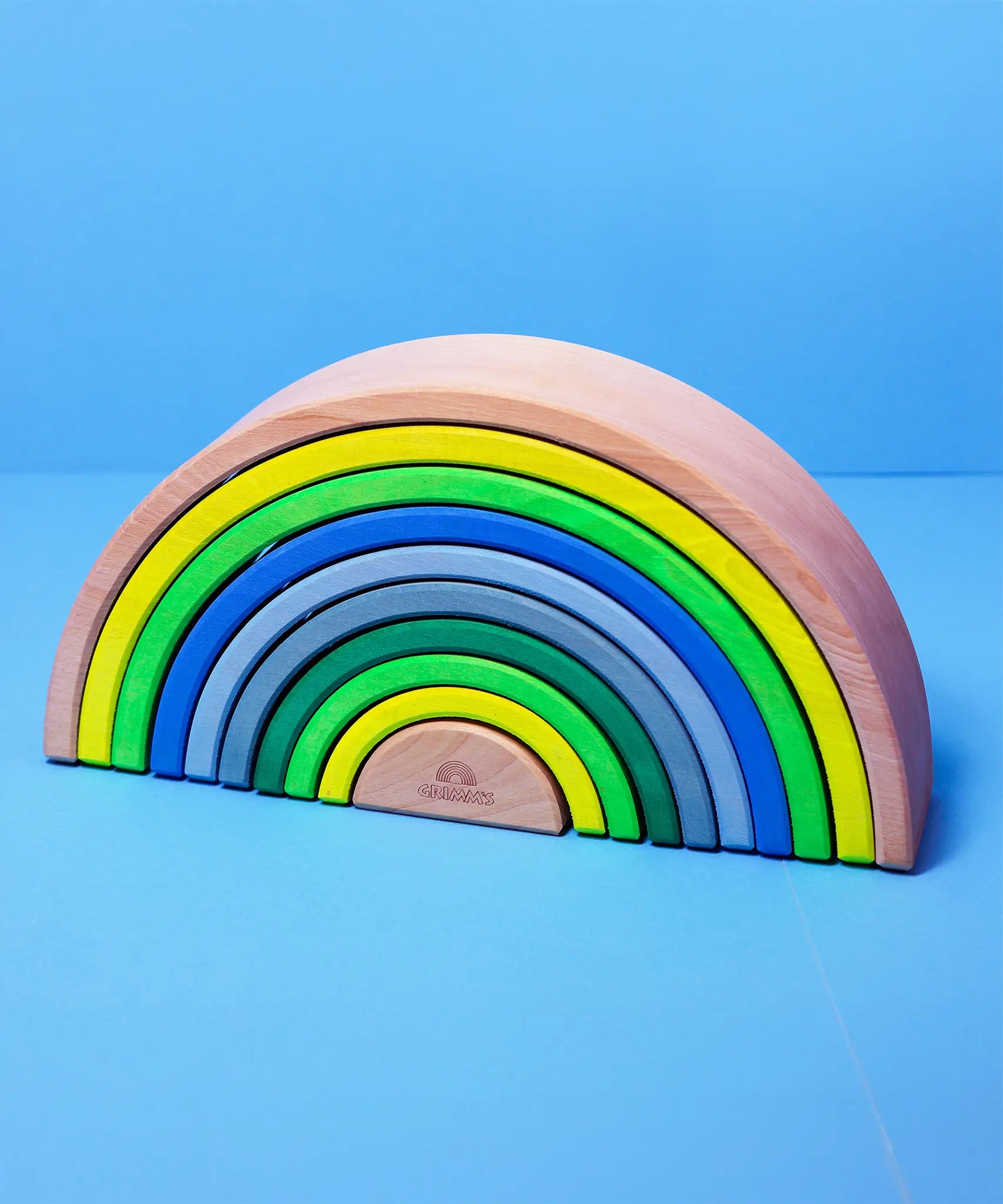 Grimm's 10 piece wooden rainbow in neon green.