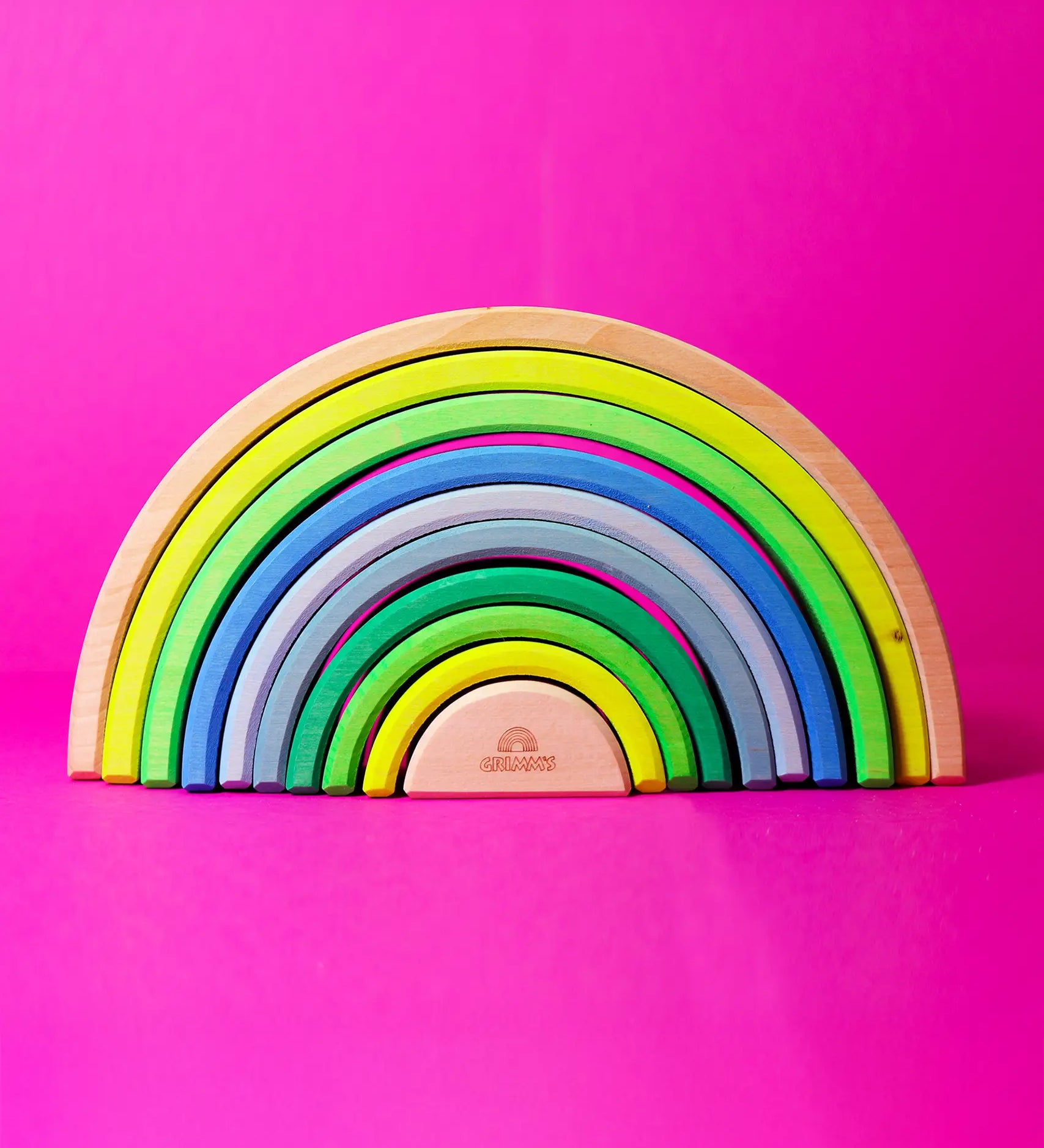 Grimm's 10 piece wooden rainbow in neon green.
