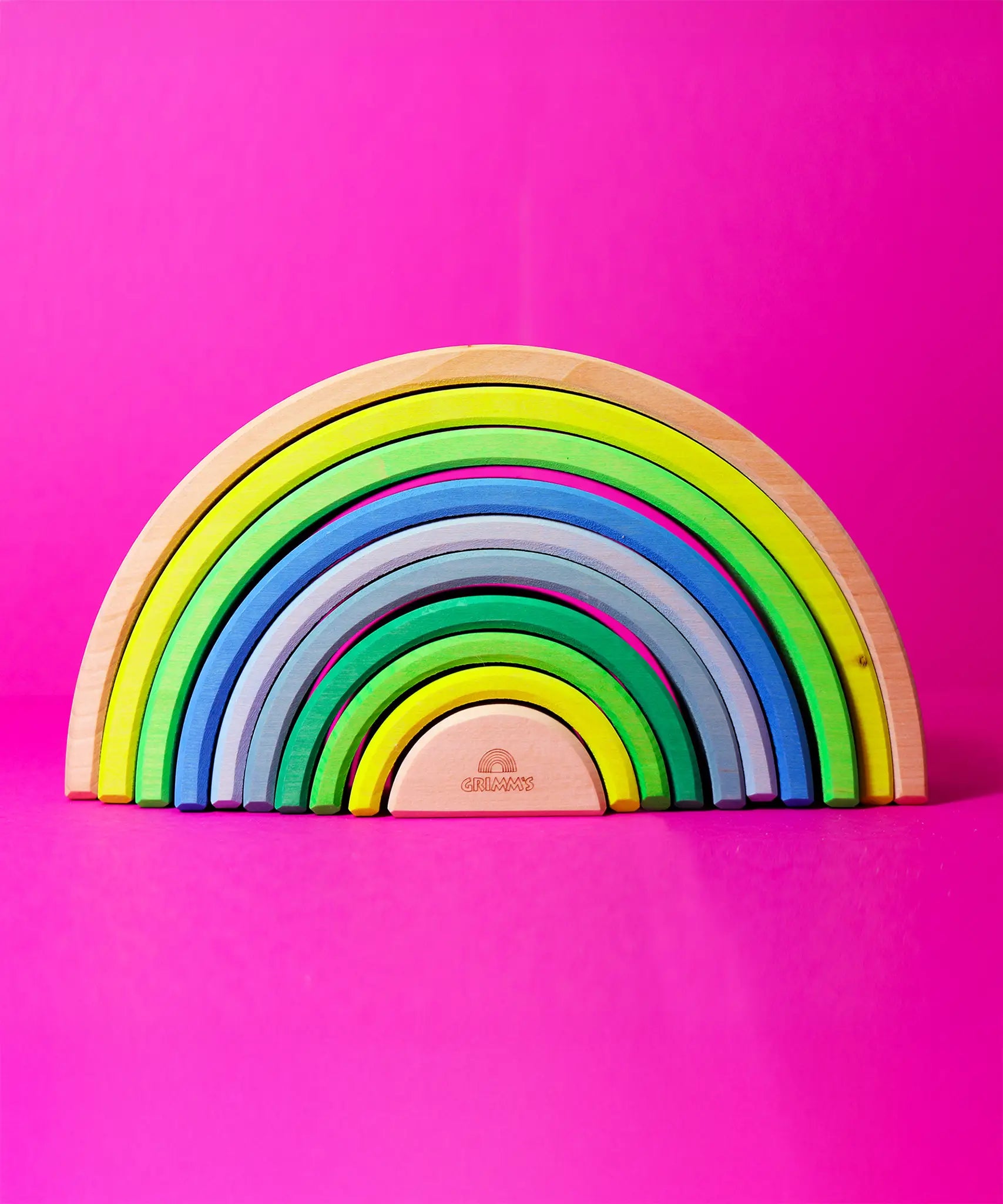 Grimm's 10 piece wooden rainbow in neon green.