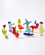 Grimm's 12 Assorted Decorative Figures for celebration rings on a plain background. 