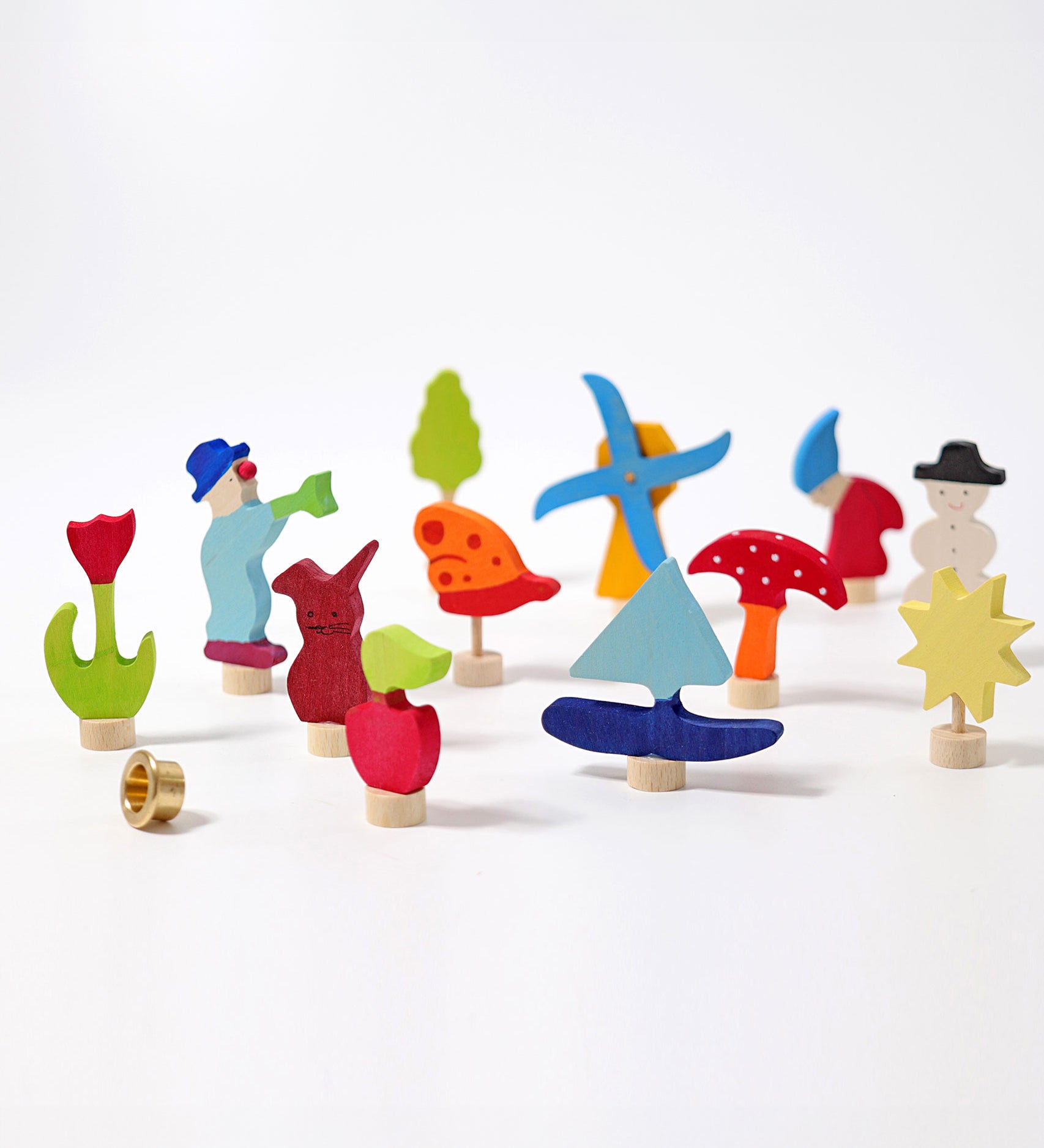 Grimm's 12 Assorted Decorative Figures for celebration rings on a plain background. 