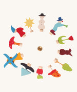 Grimm's 12 Assorted Decorative Figures for celebration rings on a plain background. 