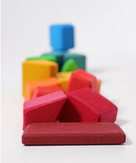 Grimm's 15 rainbow coloured wooden toy building blocks.