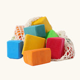 Grimm's 15 rainbow coloured wooden toy building blocks in a net storage bag.