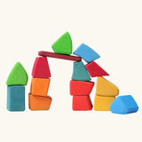 Grimm's 15 rainbow coloured wooden toy building blocks.