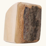 Close up of one block from the Grimm's 15 wooden blocks with natural bark.