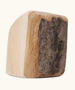 Close up of one block from the Grimm's 15 wooden blocks with natural bark.