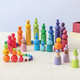 A playscene using Grimms wooden beads, cylinder blocks and peg dolls