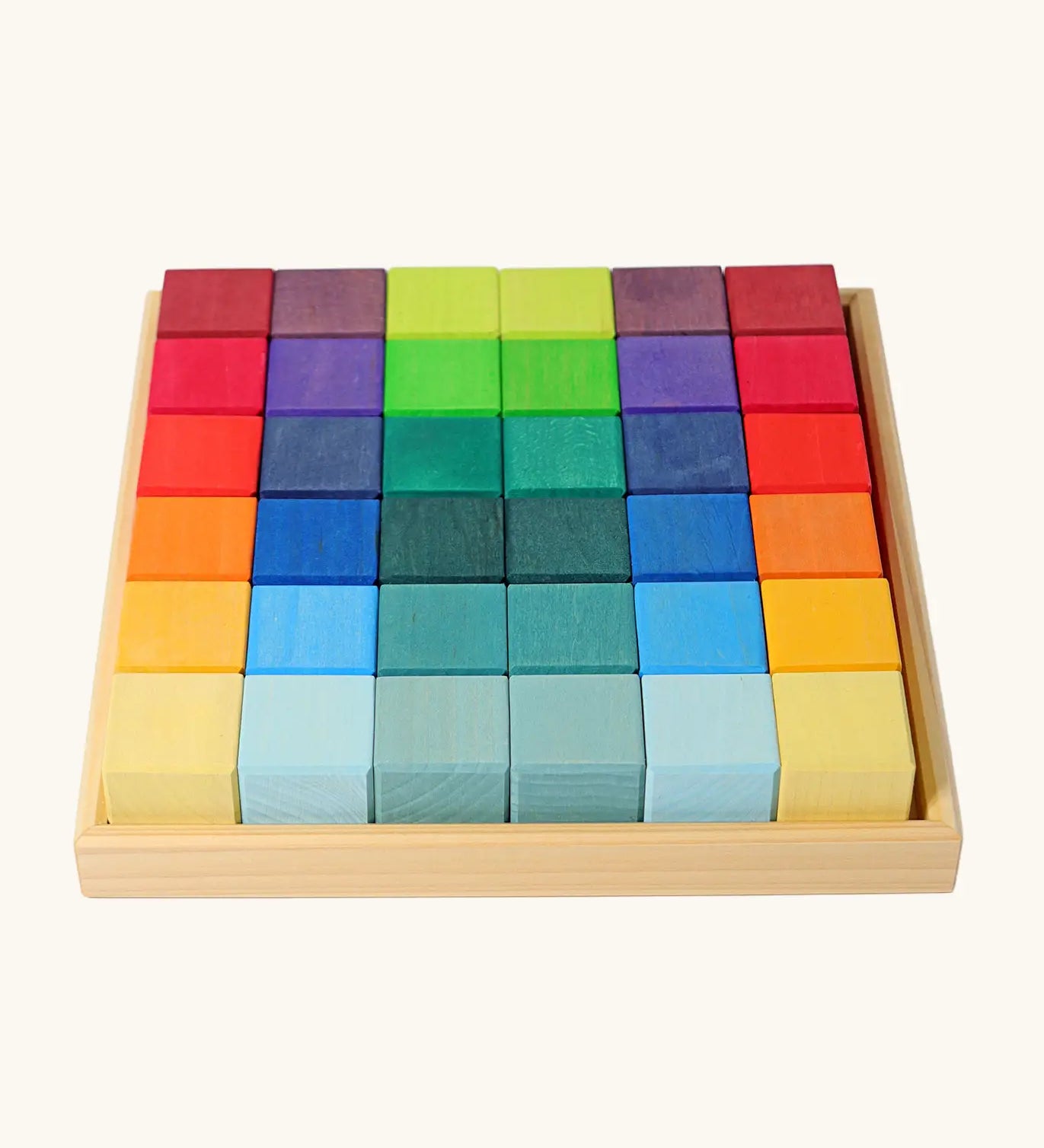 Grimm's 36 rainbow cubes wooden blocks in a storage tray. 