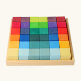 Grimm's 36 rainbow cubes wooden blocks in a storage tray. 