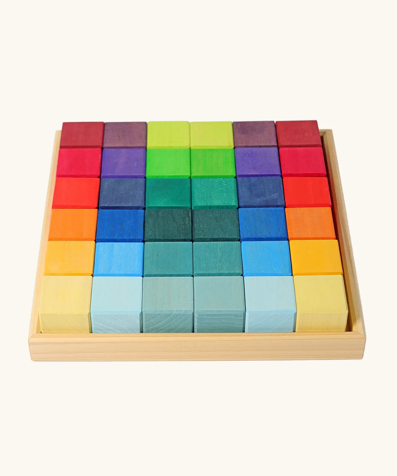 Grimm's 36 rainbow cubes wooden blocks in a storage tray. 