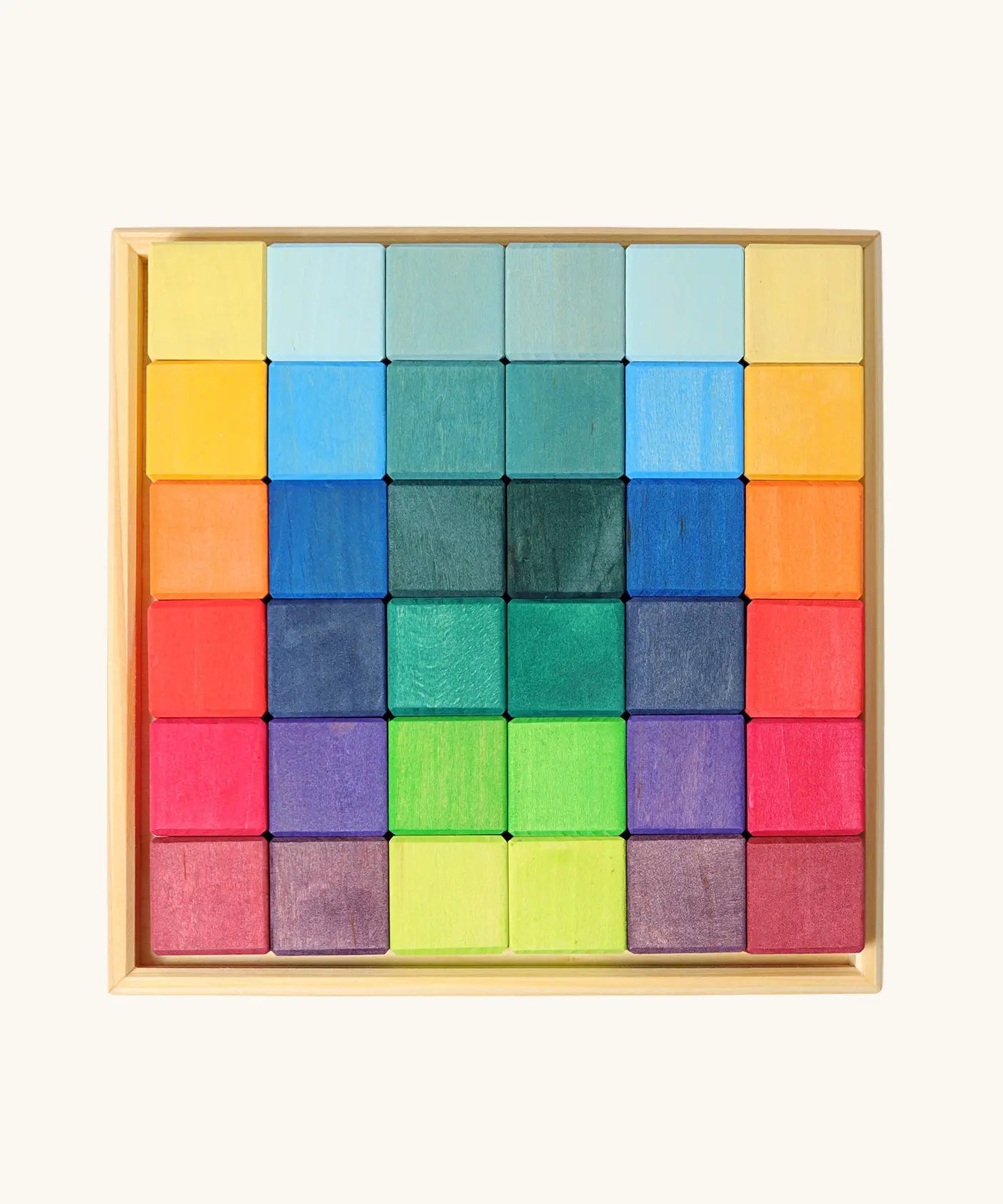 Grimm's 36 rainbow cubes wooden blocks in a storage tray. 