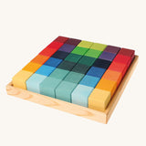 Grimm's 36 rainbow cubes wooden blocks in a storage tray. 