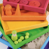 6 handcrafted wooden Grimm's frames in a rainbow palette showing little treasures stored in each frame