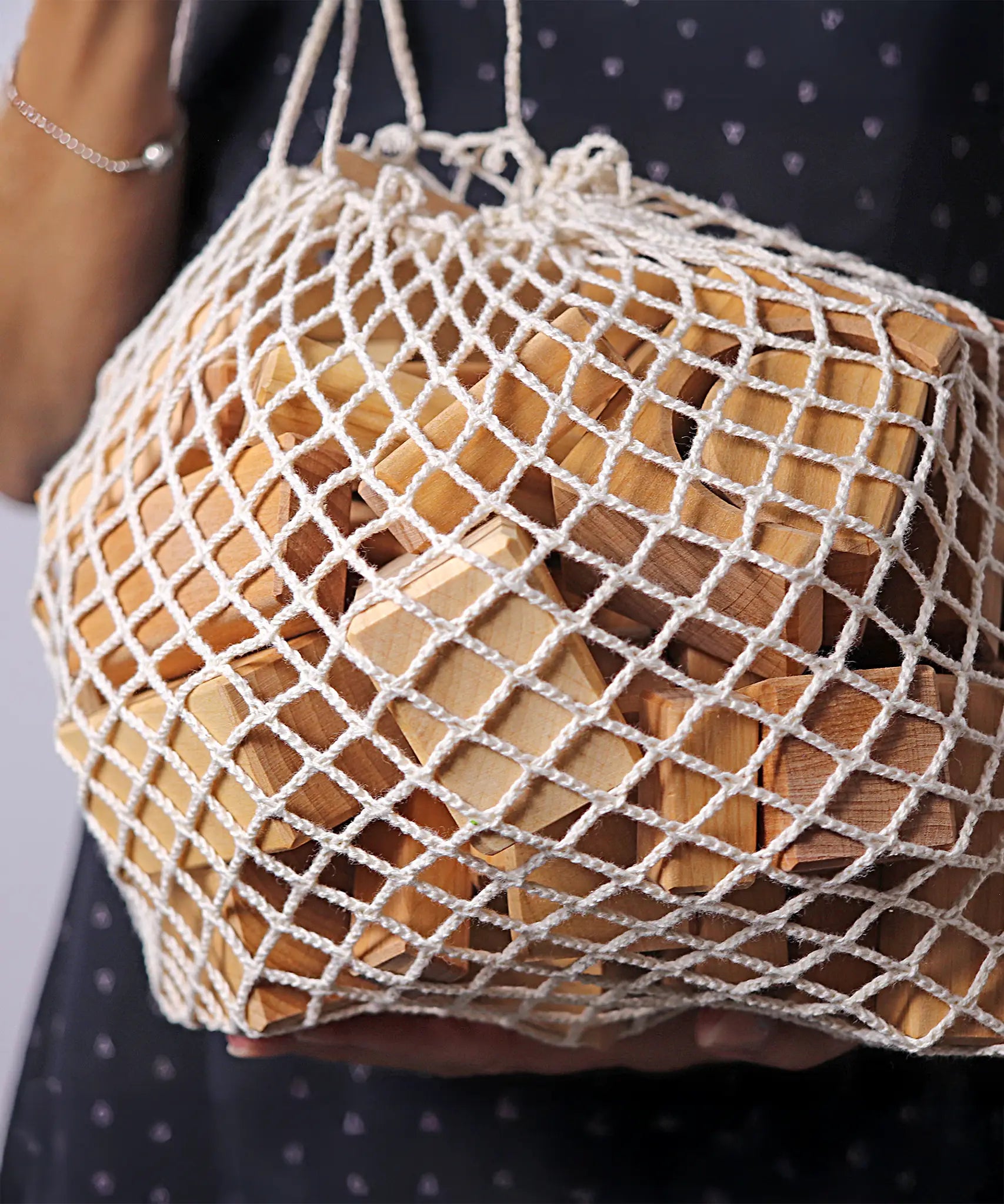 Grimm's 60 natural geo wooden building blocks in a net storage bag
