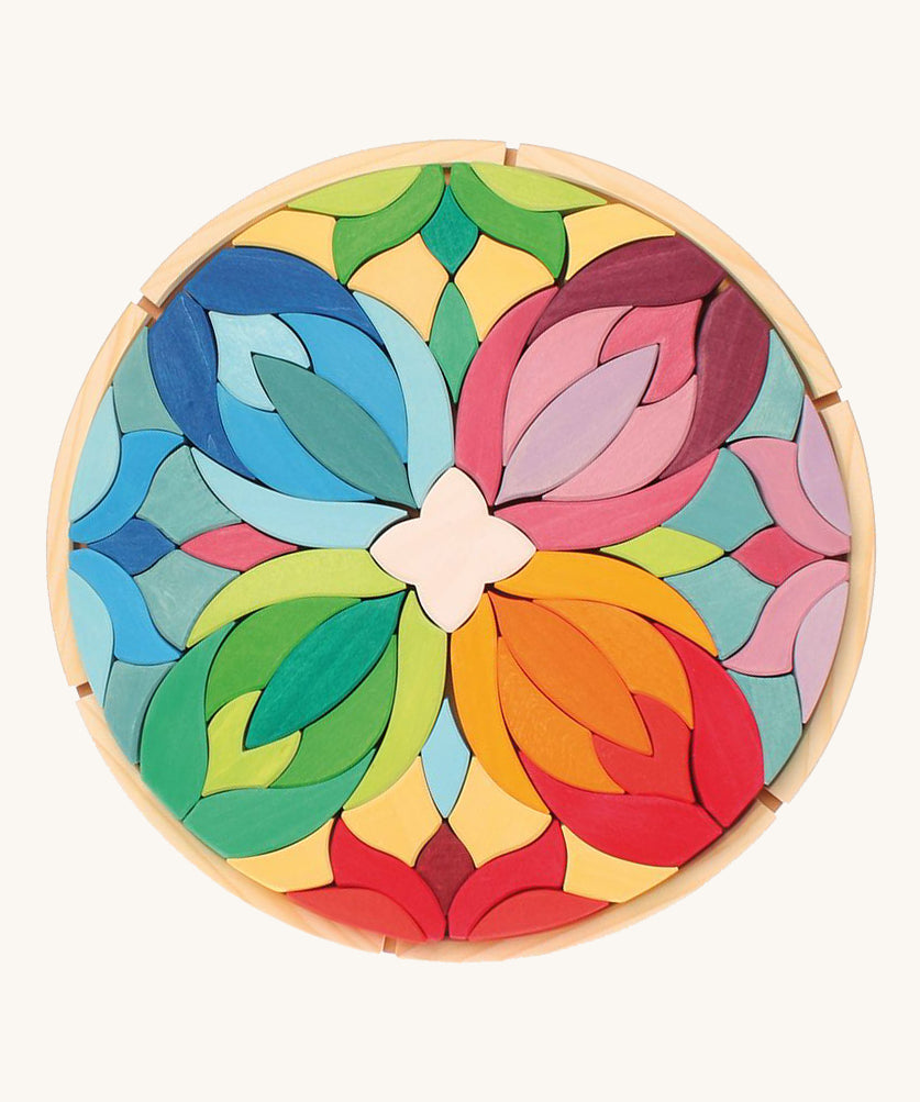 Grimm's Lara Mandala Building Set in a wooden tray.