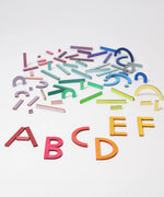 Grimm's alphabet letter shapes. 77 handcrafted wooden pieces in six shapes and 26 colours made for spelling out simple words, numbers and pictures