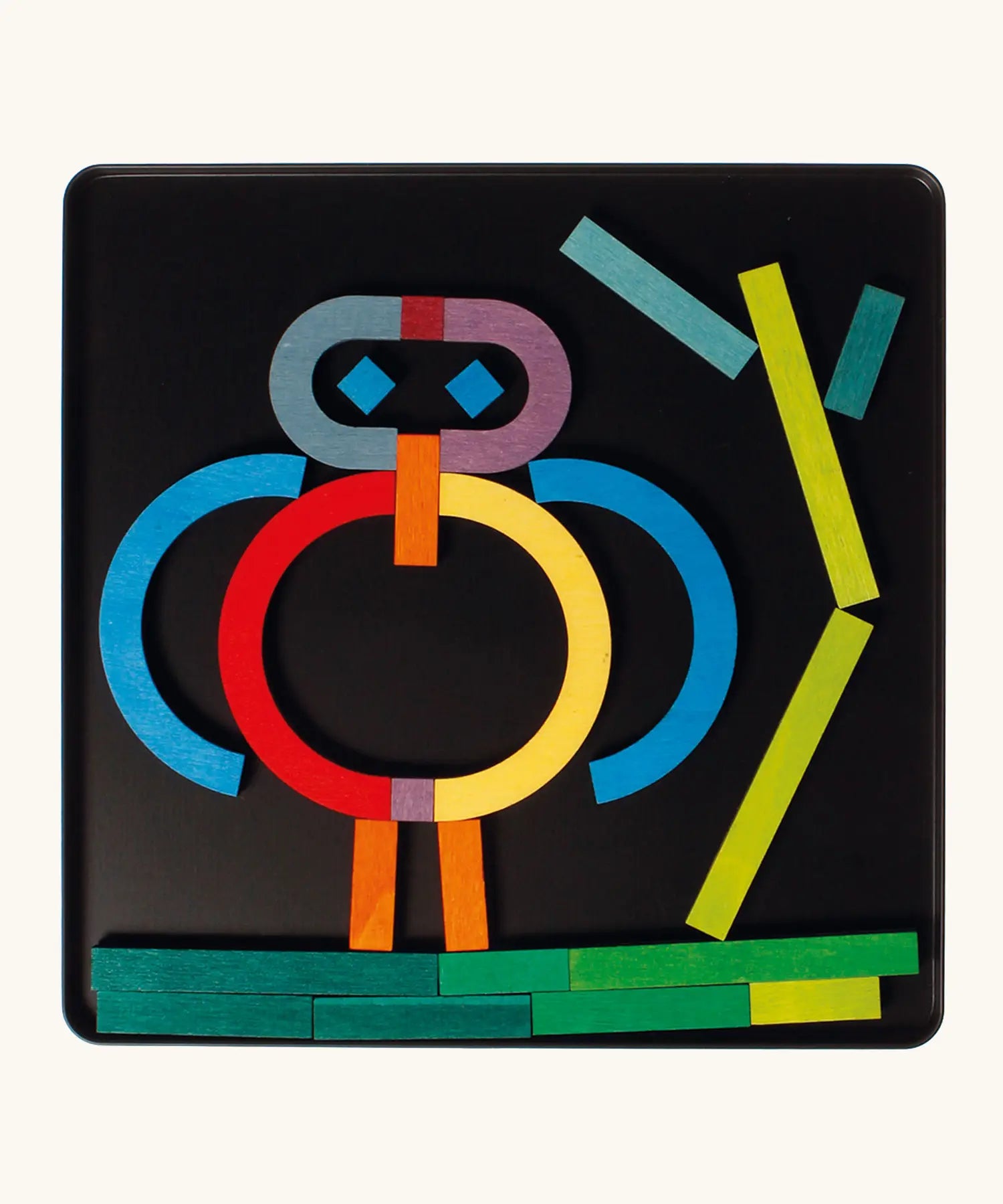 A abstract character made from the Grimm's bright wooden A-Z curved and straight magnetic pieces displayed in a tin 