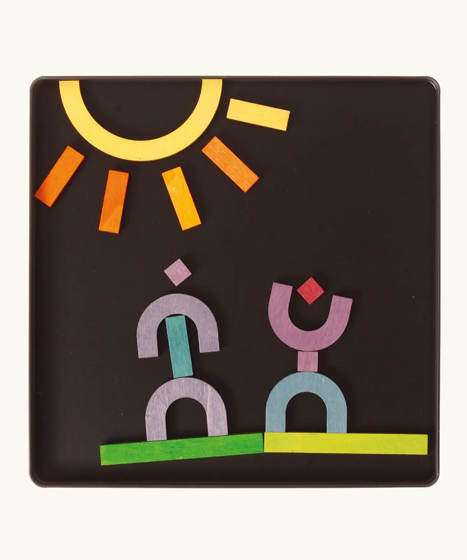 A sunny landscape made from the Grimm's bright wooden A-Z curved and straight magnetic pieces displayed in a tin 