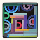 Grimms A-Z magnet puzzle set. Includes 77 curved and straight plywood magnetic pieces in bright colours and a storage tin