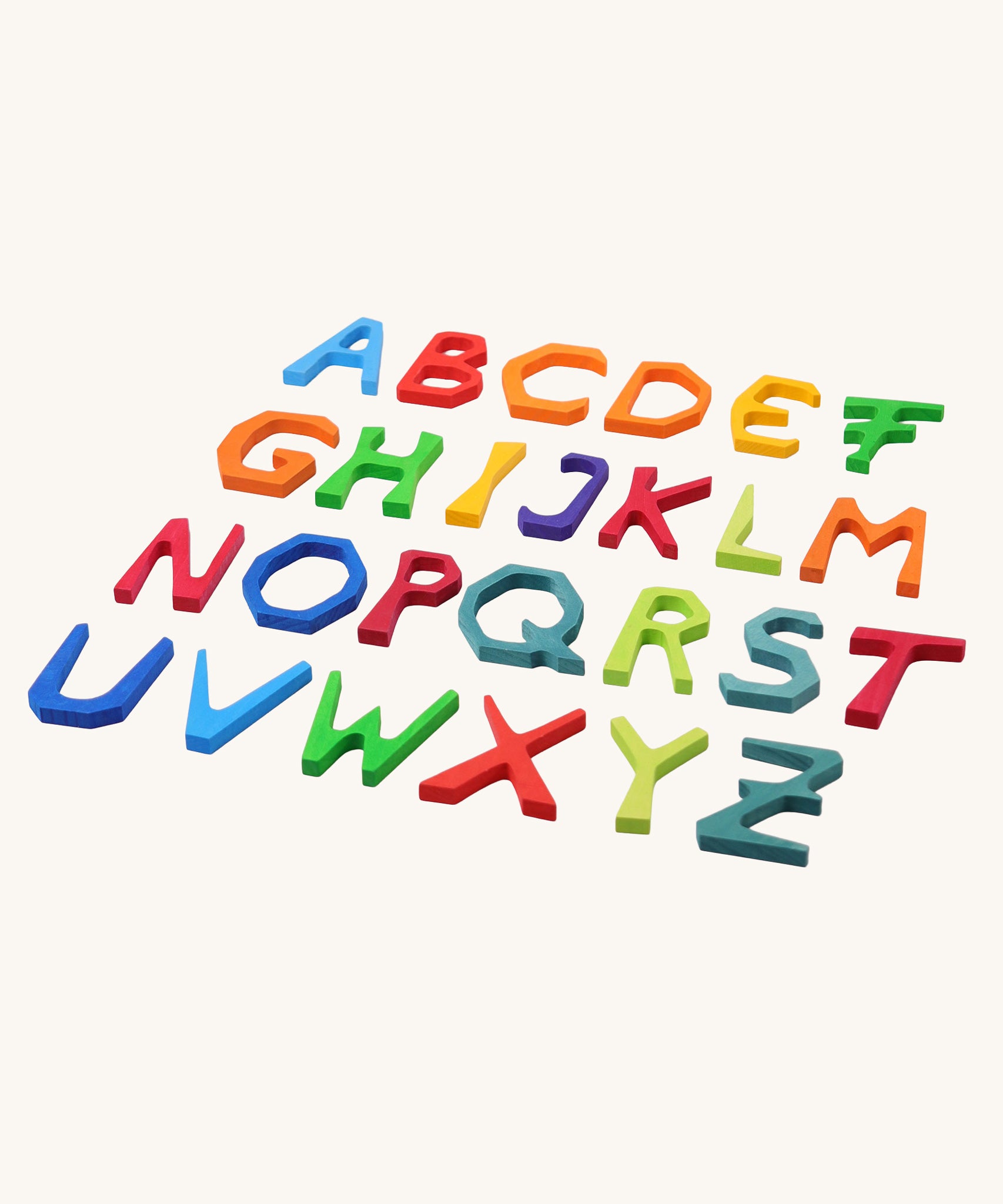 Grimm's Anthroposophical wooden Letters in a rainbow of colours. All 24 wooden letters laid flat. 