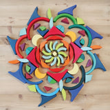 Grimm's Arcs in Squares Wooden Building Set blocks used to create a mandala.