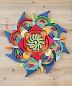 Grimm's Arcs in Squares Wooden Building Set blocks used to create a mandala.