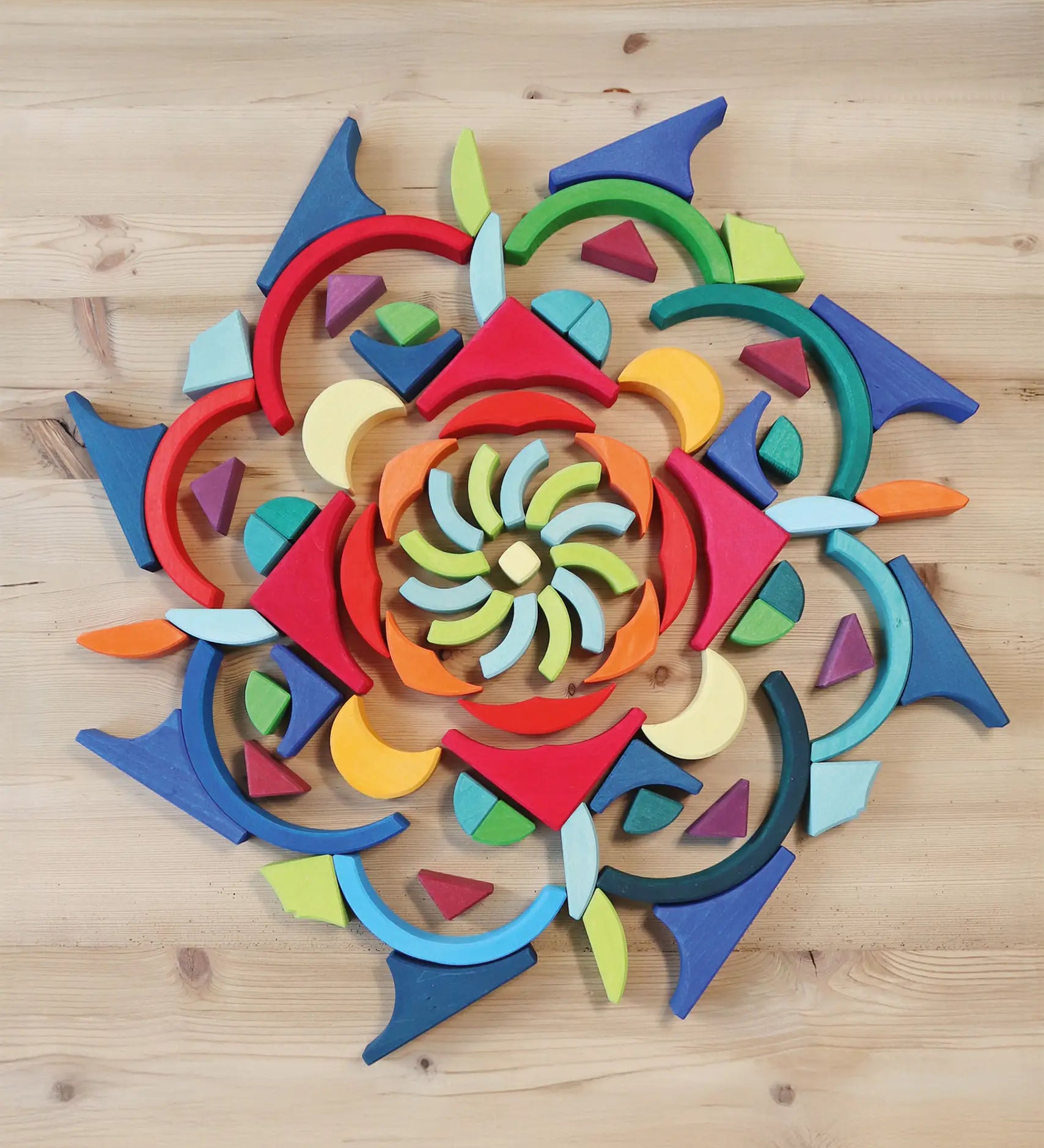 Grimm's Arcs in Squares Wooden Building Set blocks used to create a mandala.