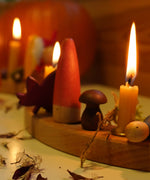 A warm and cosy Autumn inspired display using a Grimm's Waldorf Celebration Ring, Grimm's decorative figures, Grimm's Candles and a Grapat nin figure available at Babipur.