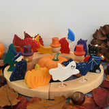 Grimm's wooden celebration ring with Autumn themed decorative figures including a owl, mushroom, dog, tree, pumpkin bat and cat