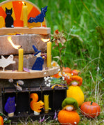Grimm's Autumn themed display with wooden celebration ring pieces, decorative figures and Ambrosius dolls