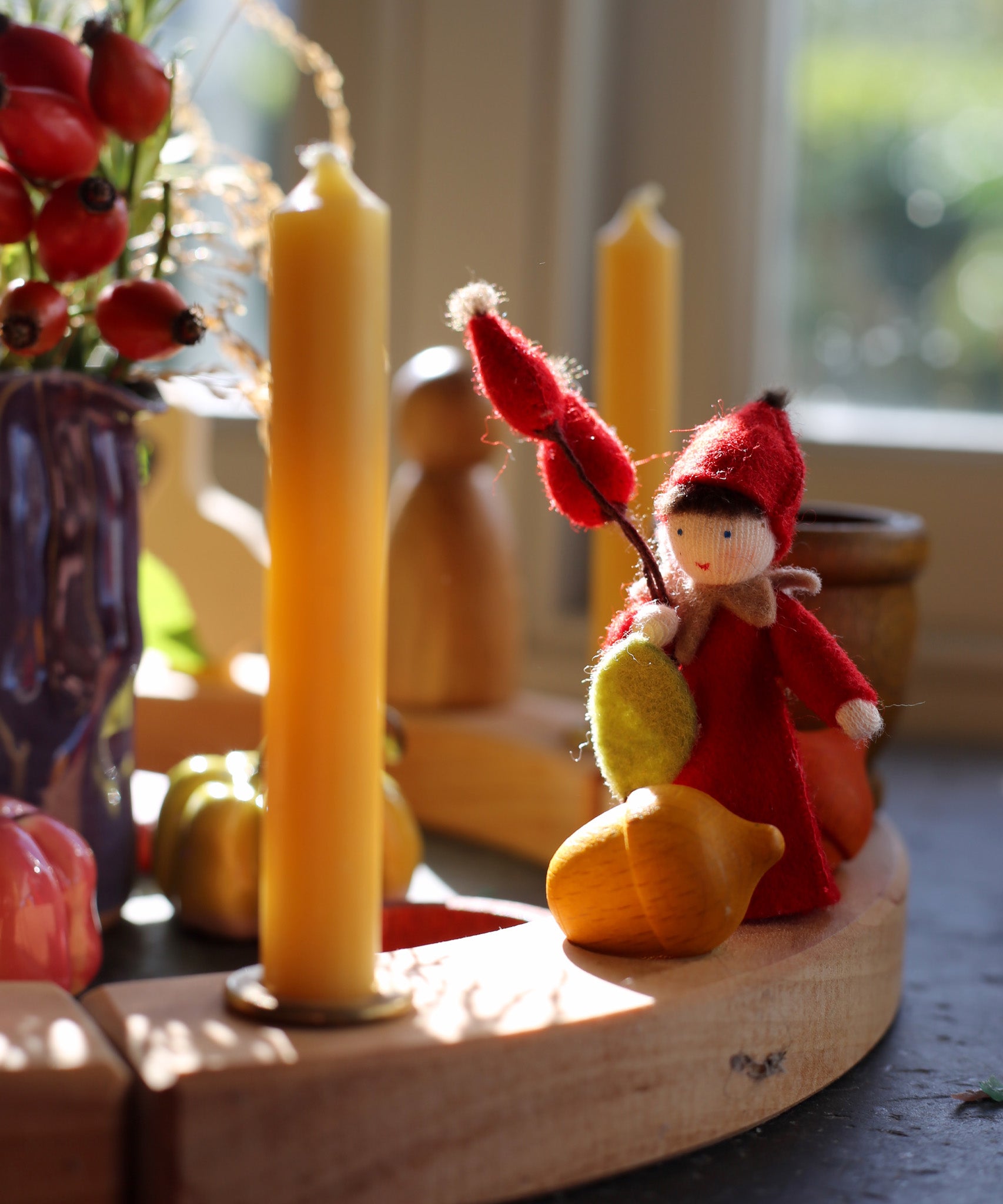 A beautiful Autumn inspired display using a Grimm's Waldorf Celebration Ring, Grimm's decorative figures, Grimm's Candles and a Ambrosius doll available at Babipur.