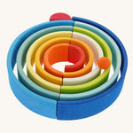 The Grimm's Gwawr Sunrise 12 Piece Rainbow on a plain background.  The pieces have been laid out to create a circular shaped ball run. 